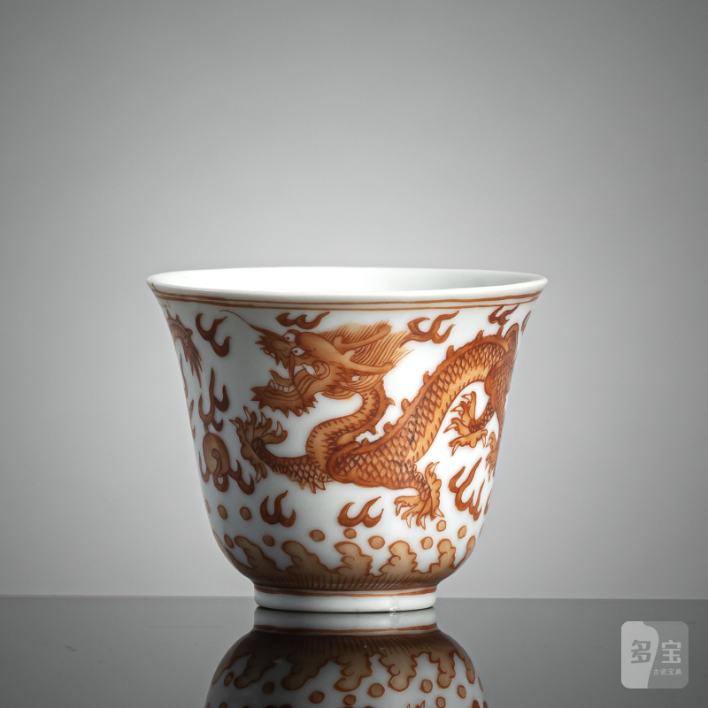 An iron red decorated porcelain dragon wine cup